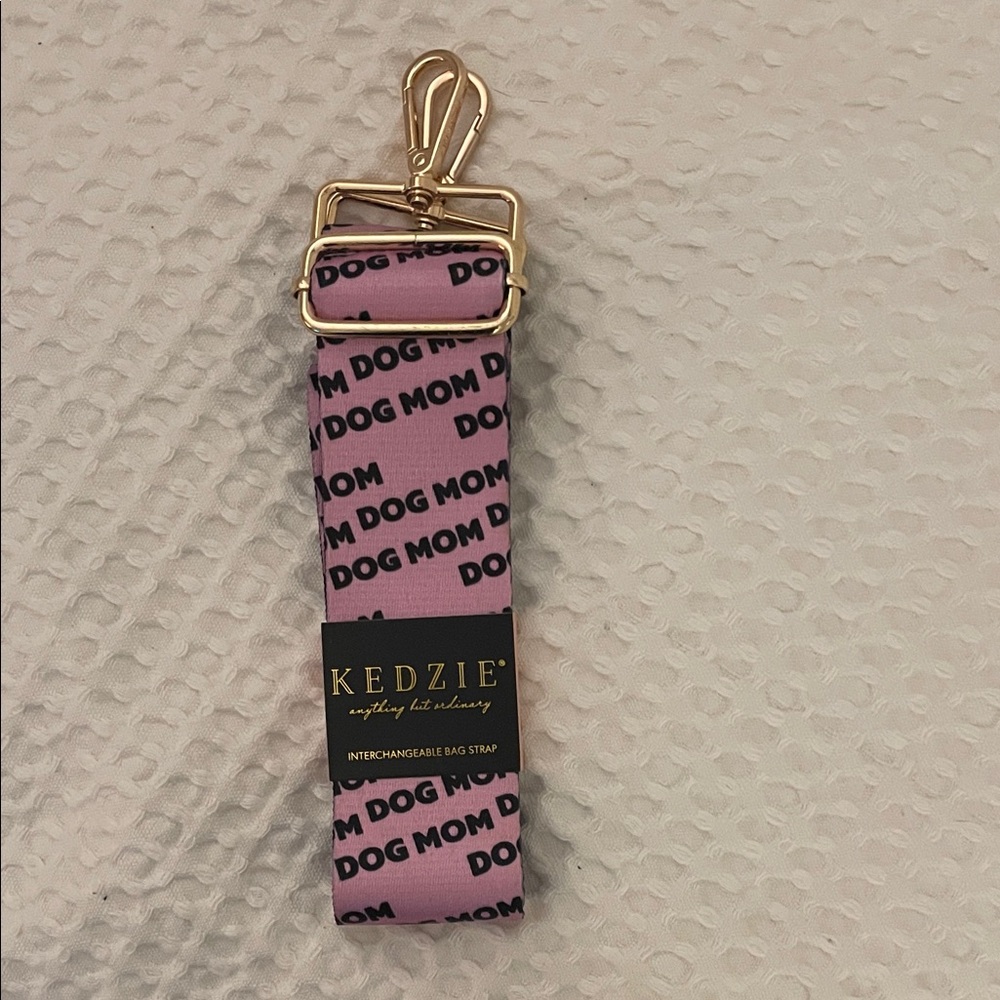 Brand new Kenzie interchangeable bag strap.  Dog mom logo.